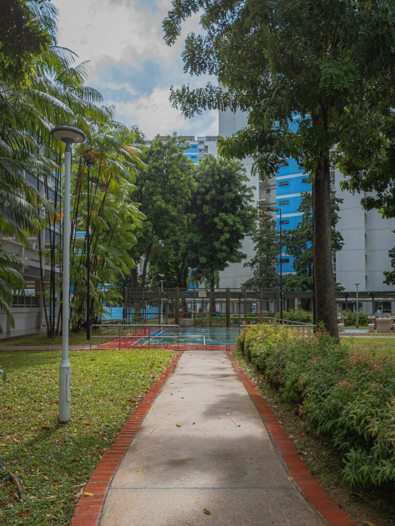 A community badminton court and HDB blocks in Jurong West, Singapore