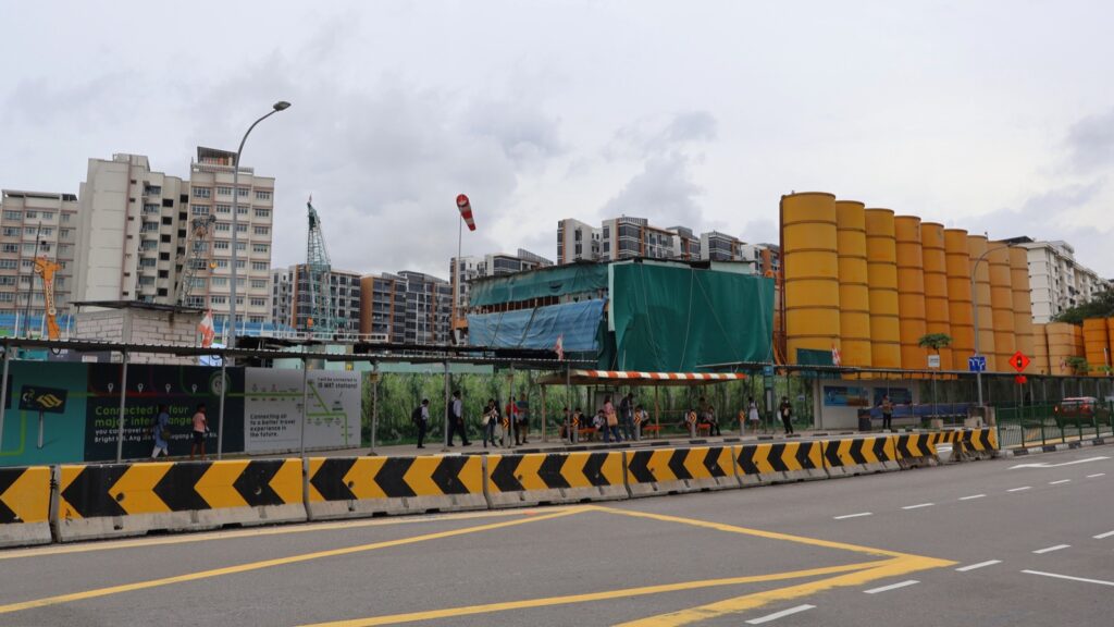 Construction works at Pasir Ris MRT with residential buildings behind the worksite
